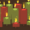 A collection of Christmas candles resembling trading candlesticks, featuring vibrant green and red flames.